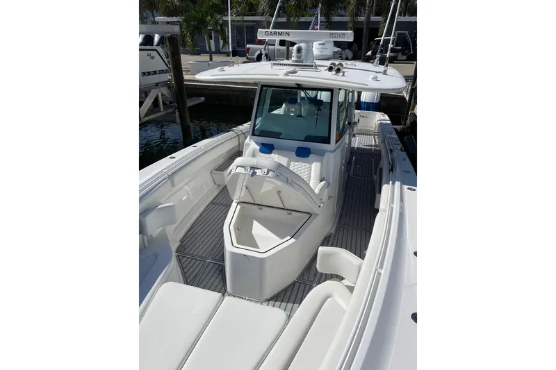 Slide: The Image of 2019 HCB 42 Siesta boat with open deck and seating, docked at marina. - 15