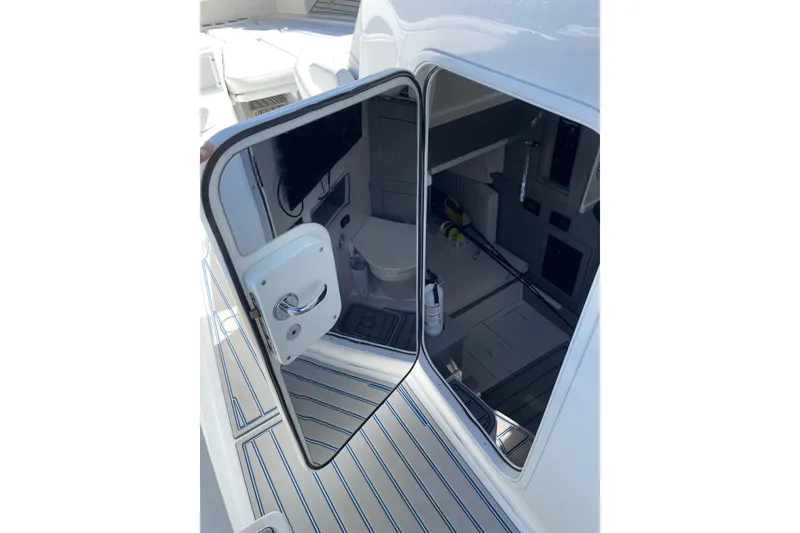 Slide: The Image of 2019 HCB 42 Siesta boat cabin entrance with open door, showcasing interior details. - 18