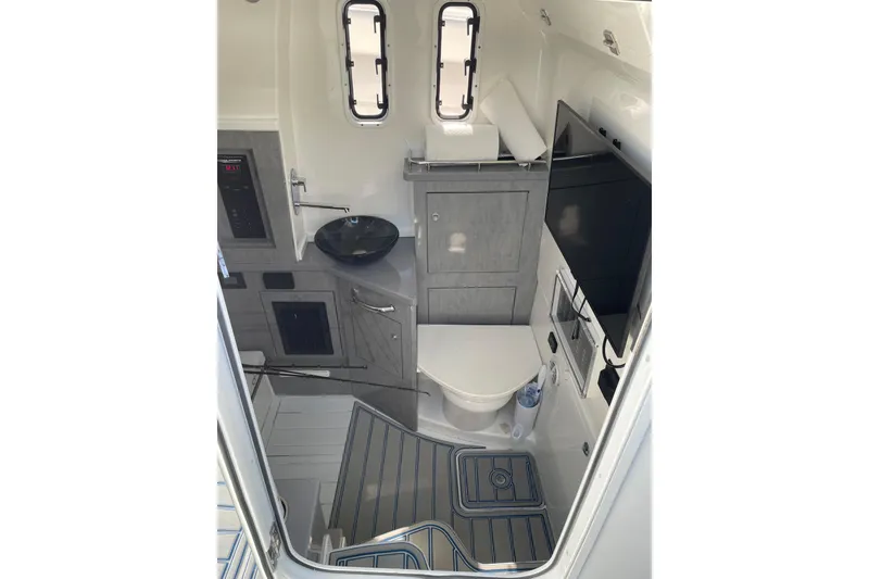 Slide: The Image of Interior of 2019 HCB 42 Siesta boat featuring modern bathroom amenities. - 19