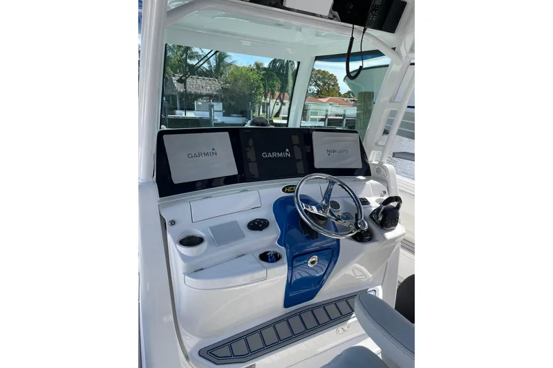 Slide: The Image of Helm of 2019 HCB 42 Siesta with Garmin displays and steering wheel. - 24