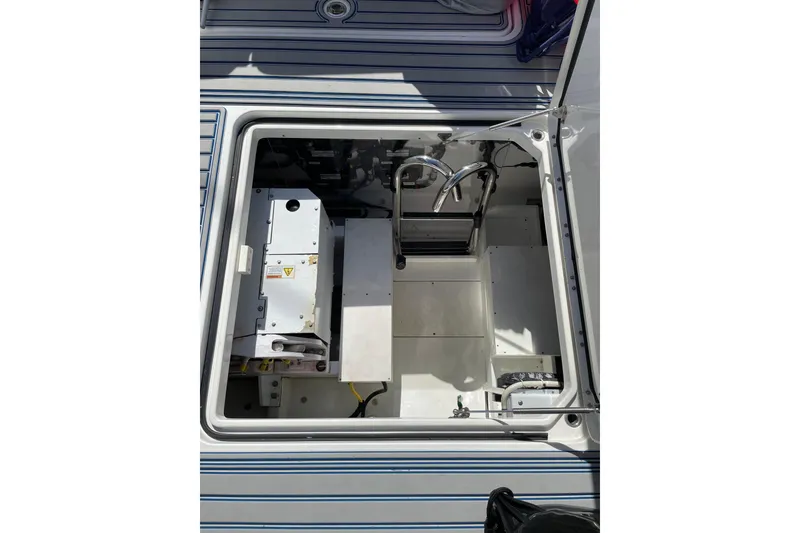Slide: The Image of Open hatch of 2019 HCB 42 Siesta boat showing interior equipment. - 30