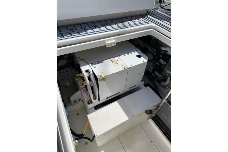 Slide: The Image of Engine compartment of a 2019 HCB 42 Siesta boat, showcasing mechanical components. - 31