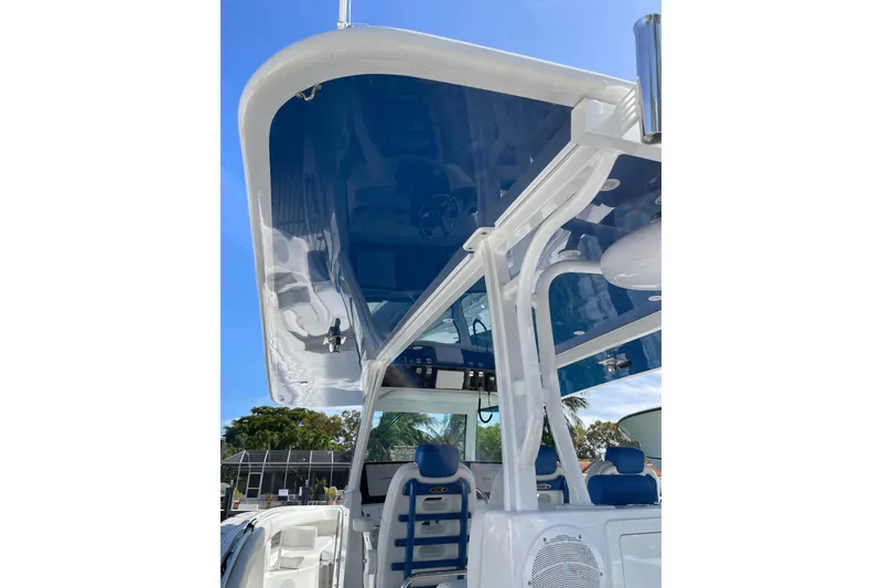 Slide: The Image of 2019 HCB 42 Siesta boat interior with open storage compartments and seating. - 9
