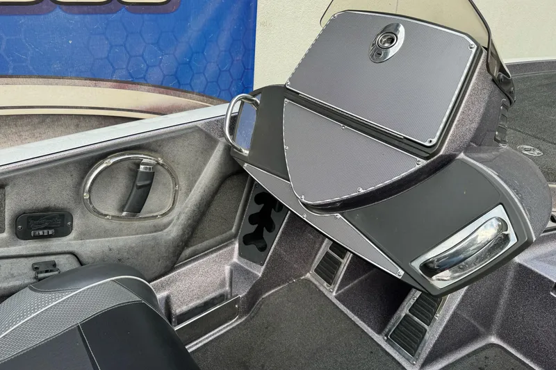 Slide: The Image of 2016 Ranger Z521 Comanche boat interior with dashboard and seating details. - 11