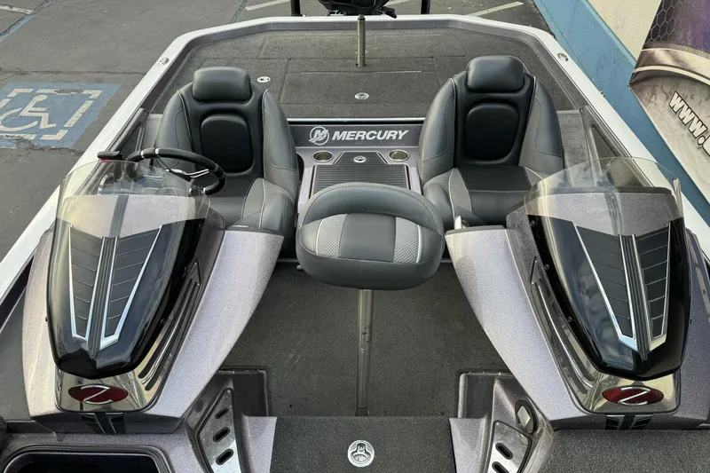 Slide: The Image of 2016 Ranger Z521 Comanche boat interior with dual seats and Mercury branding. - 15