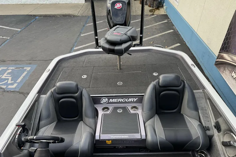 Slide: The Image of 2016 Ranger Z521 Comanche boat interior with Mercury branding and dual seats. - 16