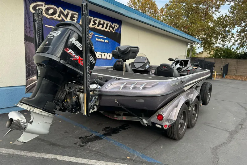 Slide: The Image of 2016 Ranger Z521 Comanche boat with Mercury 250 Pro XS engine, parked outdoors. - 3