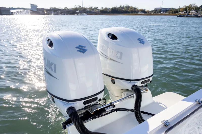 Slide: The Image of Twin Suzuki outboard engines on 2023 Pair Customs 24 Center Console DV boat. - 9