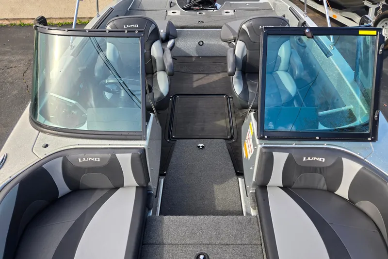 Slide: The Image of 2020 Lund 189 Tyee GL boat interior with seating and windshield. - 10