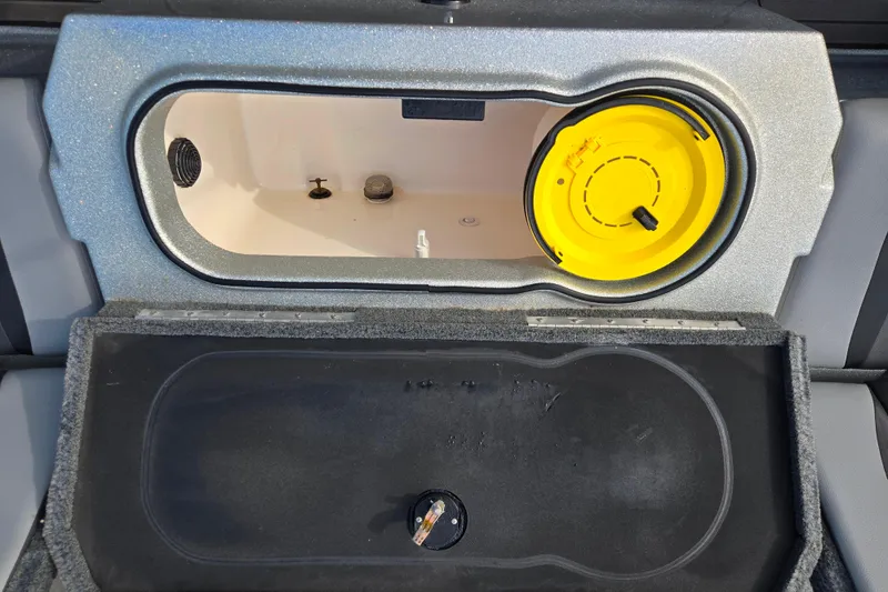 Slide: The Image of 2020 Lund 189 Tyee GL boat storage compartment with yellow hatch cover. - 11