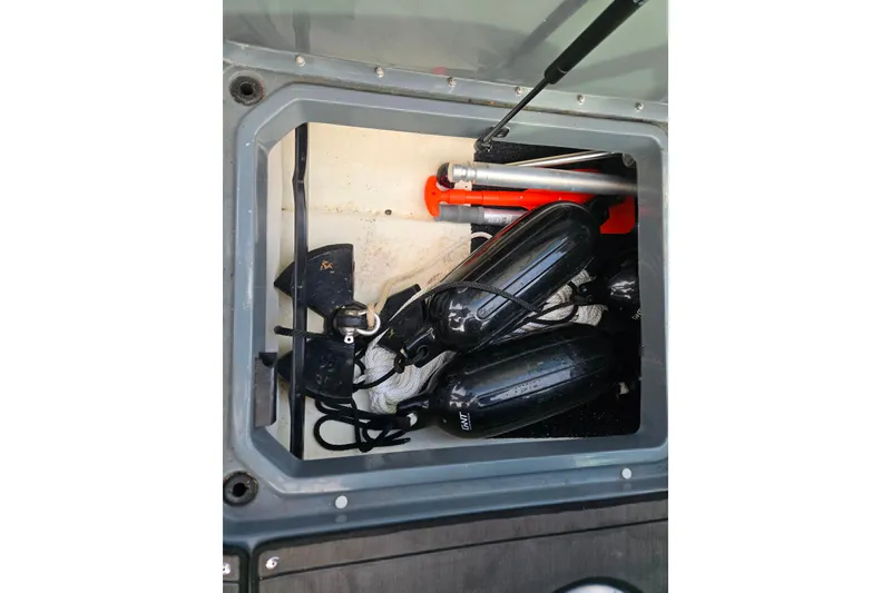 Slide: The Image of Storage compartment of 2020 Lund 189 Tyee GL boat with equipment and accessories. - 13
