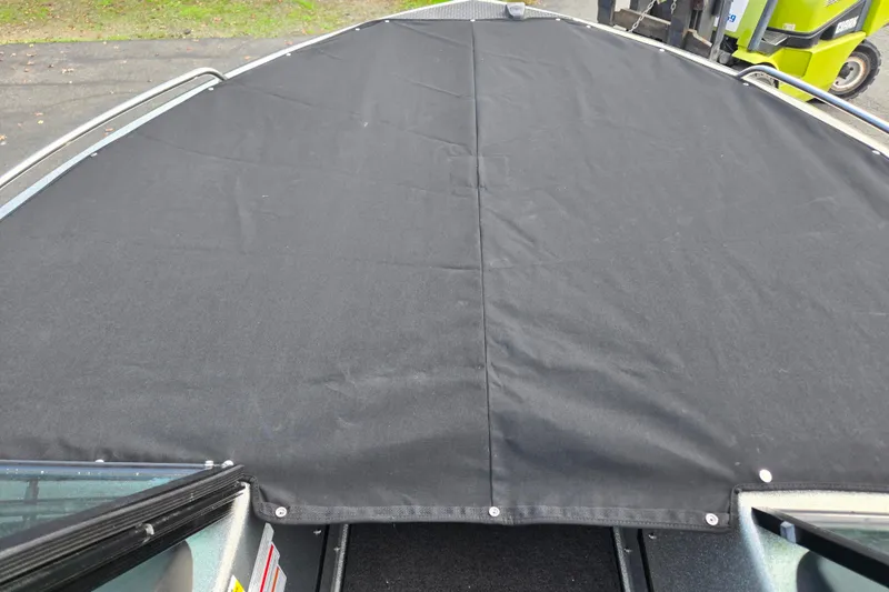 Slide: The Image of 2020 Lund 189 Tyee GL boat with black cover on deck. - 14