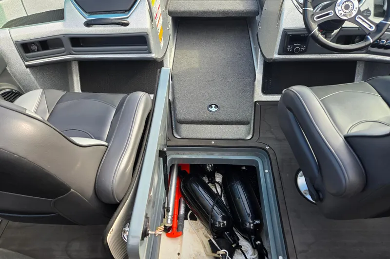 Slide: The Image of 2020 Lund 189 Tyee GL boat interior with storage compartment open. - 16