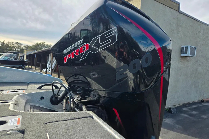 Slide: The Image of 2020 Lund 189 Tyee GL with Mercury Pro XS 200 engine, parked outdoors. - 17