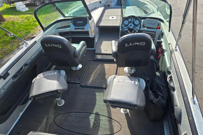 Slide: The Image of 2020 Lund 189 Tyee GL boat interior with seating and dashboard view. - 19