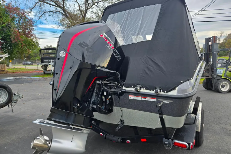 Slide: The Image of 2020 Lund 189 Tyee GL boat with Mercury Pro XS outboard motor, covered and on trailer. - 3