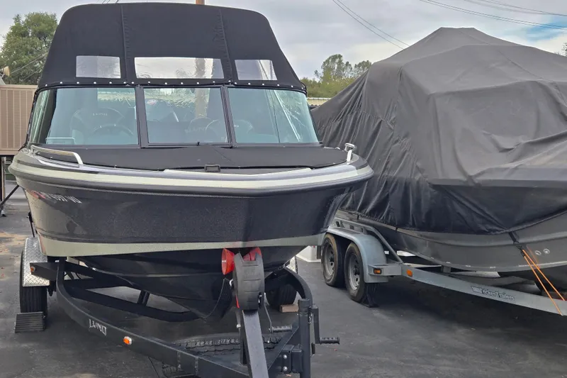 Slide: The Image of 2020 Lund 189 Tyee GL boat on trailer, covered, parked outdoors. - 4