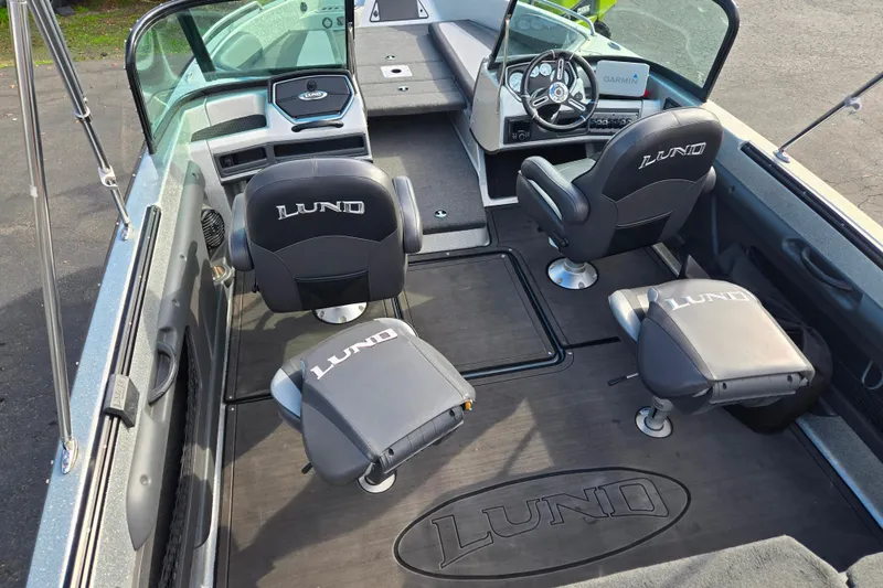 Slide: The Image of 2020 Lund 189 Tyee GL boat interior with branded seats and steering console. - 5