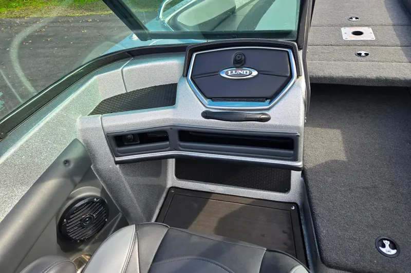 Slide: The Image of 2020 Lund 189 Tyee GL boat interior with dashboard and seating area. - 7