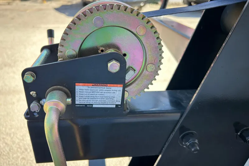 Slide: The Image of 2018 Sun Tracker Party Barge 18 DLX pontoon boat on trailer by waterfront. - 11