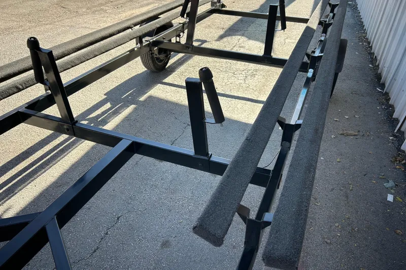 Slide: The Image of 2018 Sun Tracker Party Barge 18 DLX pontoon boat in a warehouse setting. - 13