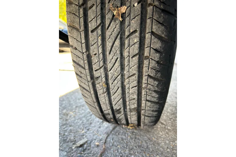 Slide: The Image of 2018 Sun Tracker Party Barge 18 DLX pontoon boat in a garage setting. - 14