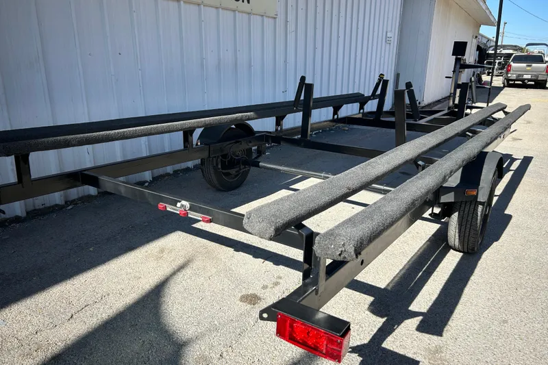 Slide: The Image of 2018 Sun Tracker Party Barge 18 DLX with Mercury 60 HP engine in a garage. - 19