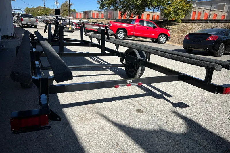 Slide: The Image of Mercury FourStroke engine on 2018 Sun Tracker Party Barge 18 DLX in a garage. - 20