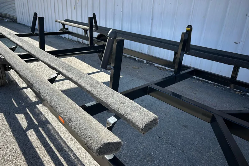 Slide: The Image of Trailer hitch of a 2018 Sun Tracker Party Barge 18 DLX on asphalt. - 23