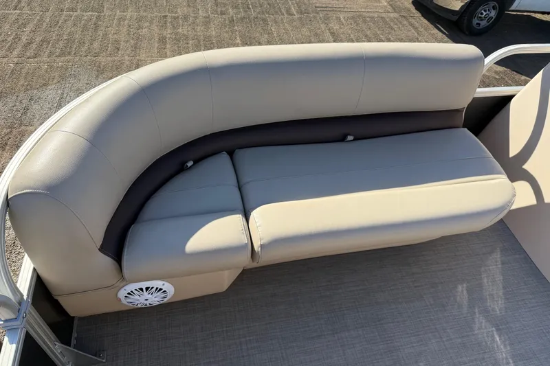 Slide: The Image of 2018 Sun Tracker Party Barge 18 DLX pontoon boat on trailer in a garage. - 28