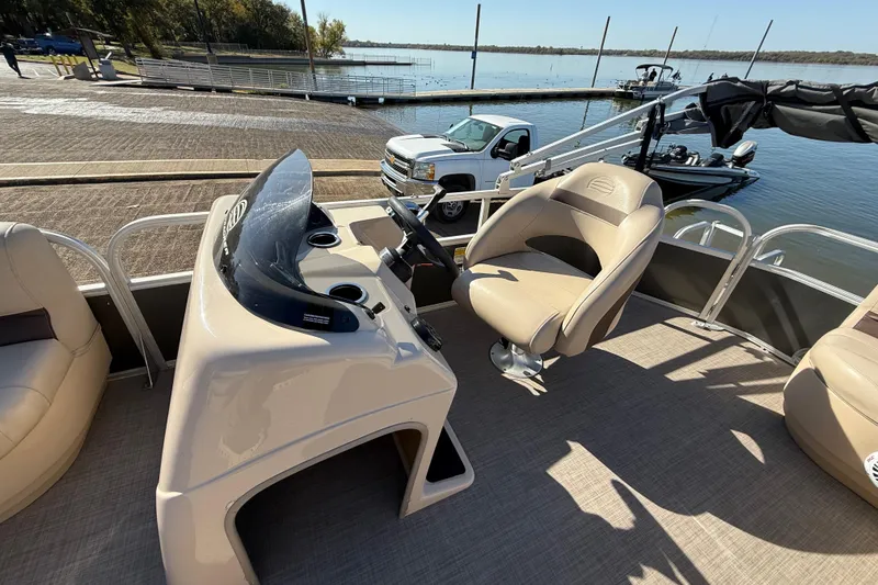 Slide: The Image of 2018 Sun Tracker Party Barge 18 DLX battery compartment with visible wiring. - 35