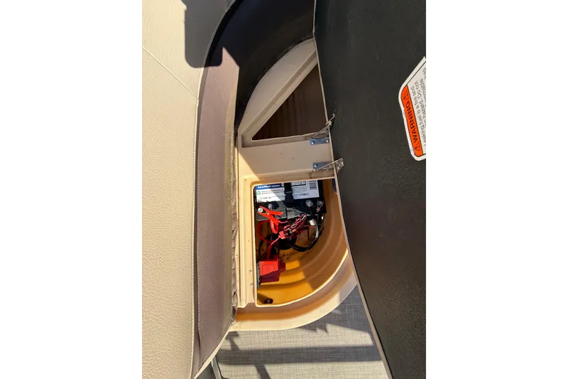 Slide: The Image of 2018 Sun Tracker Party Barge 18 DLX helm with steering wheel and captain's chair. - 37