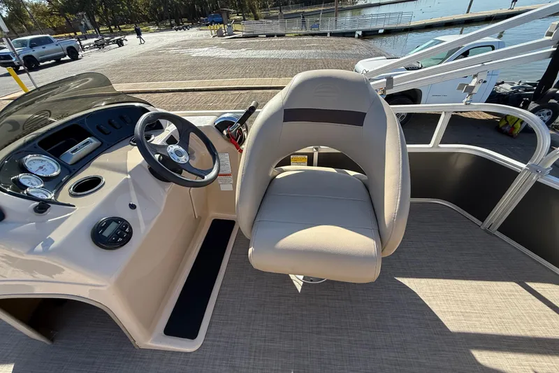 Slide: The Image of 2018 Sun Tracker Party Barge 18 DLX pontoon boat on trailer, with Mercury outboard motor. - 40