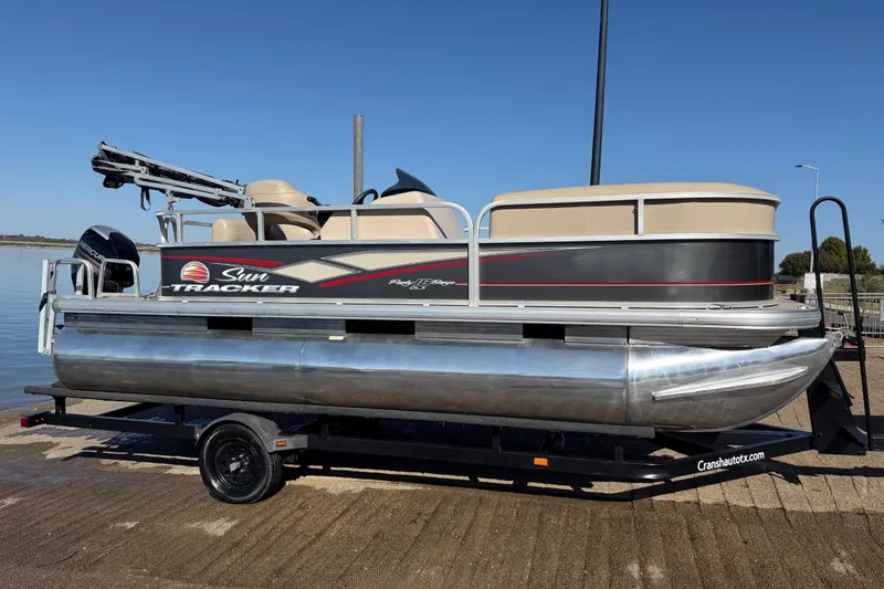Slide: The Image of Close-up of a 2018 Sun Tracker Party Barge 18 DLX propeller on a trailer. - 44
