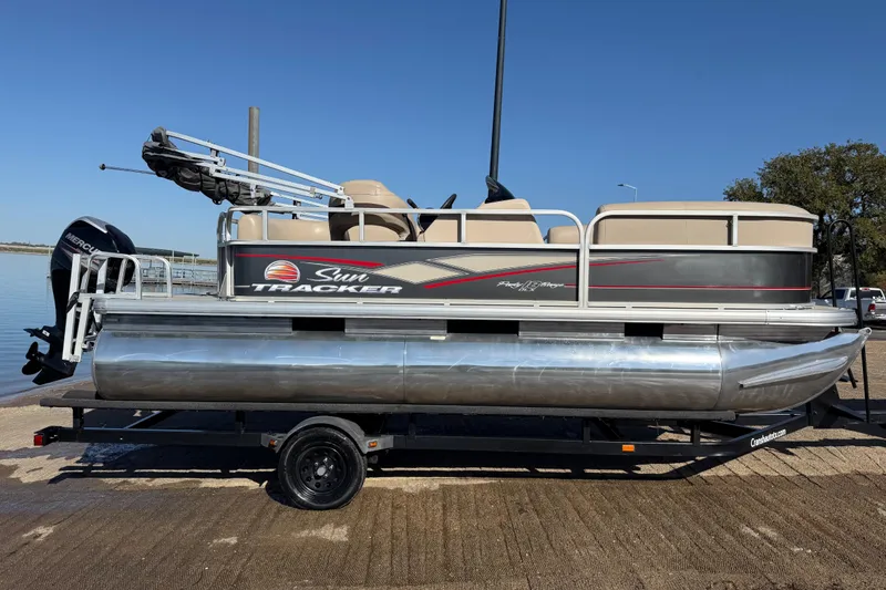 Slide: The Image of 2018 Sun Tracker Party Barge 18 DLX with Mercury 60 outboard engine on trailer. - 45
