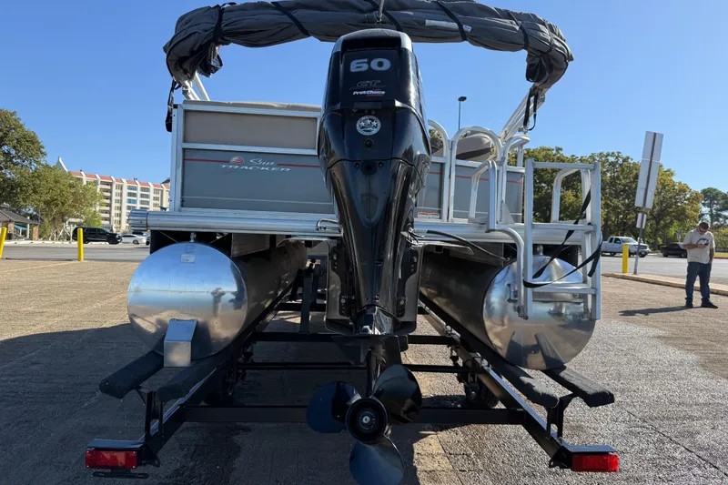 Slide: The Image of 2018 Sun Tracker Party Barge 18 DLX on trailer by a lake. - 51