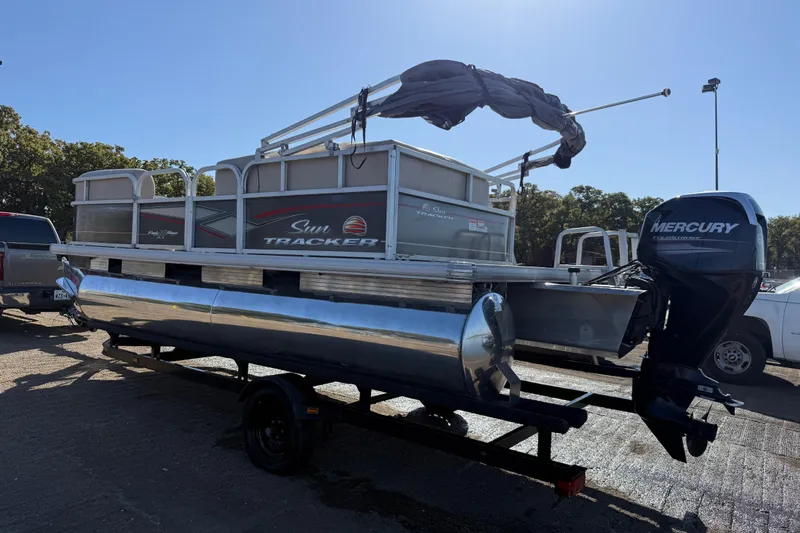 Slide: The Image of 2018 Sun Tracker Party Barge 18 DLX pontoon boat on calm water. - 54