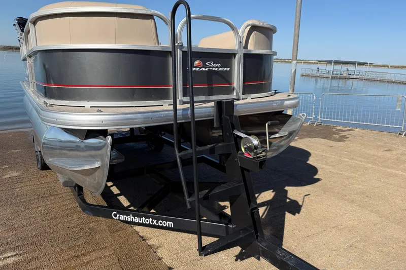 Slide: The Image of 2018 Sun Tracker Party Barge 18 DLX trailer frame on pavement. - 62