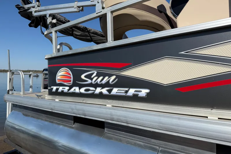 Slide: The Image of 2018 Sun Tracker Party Barge 18 DLX trailer frame on pavement. - 65