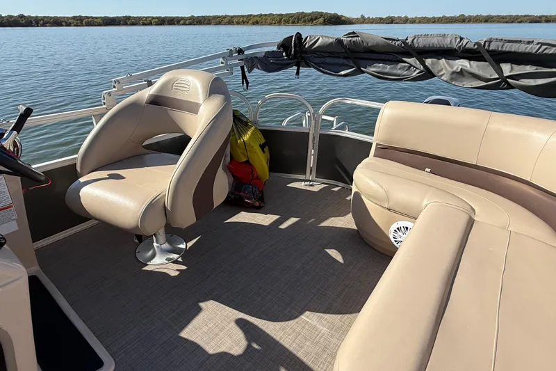 Slide: The Image of Close-up of a black wheel rim on a 2018 Sun Tracker Party Barge 18 DLX. - 70