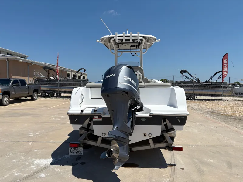 Slide: The Image of 2021 Sportsman Heritage 241 Center Console boat with Yamaha 300 engine, parked outdoors. - 10