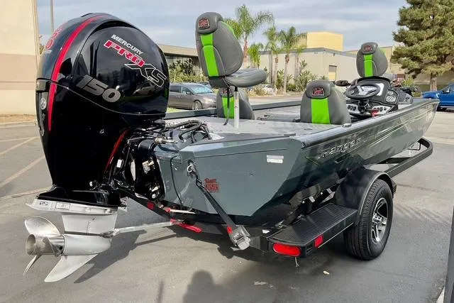 Slide: The Image of 2023 Ranger RT198P boat with Mercury 150 engine, parked outdoors. - 13