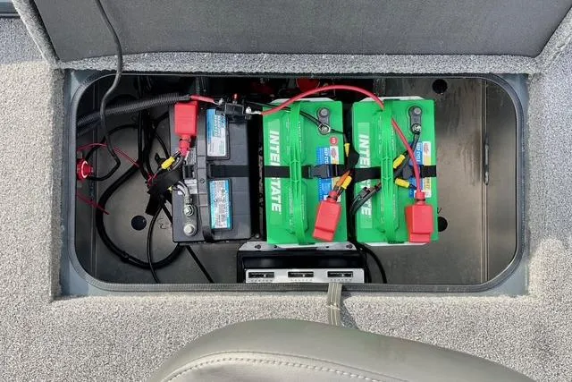 Slide: The Image of 2023 Ranger RT198P boat battery compartment with Interstate batteries and wiring. - 25