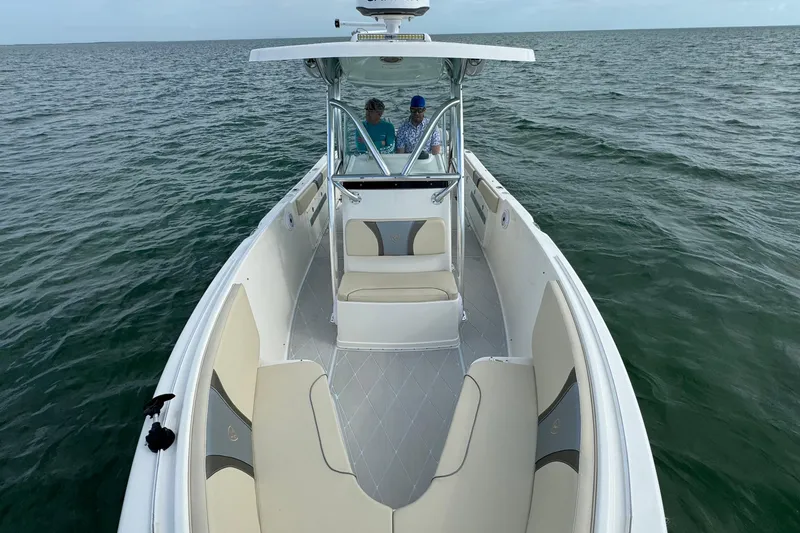 Slide: The Image of 2015 Century 2600 CC boat on open water, featuring spacious seating and modern design. - 18