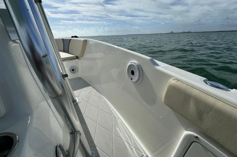 Slide: The Image of 2015 Century 2600 CC boat interior with ocean view, featuring stainless steel and cushioned seating. - 30