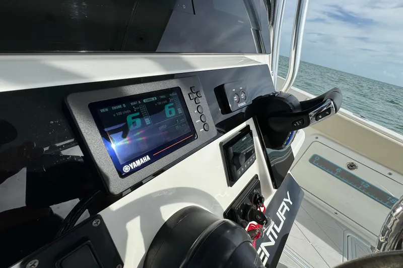 Slide: The Image of Century 2600 CC 2015 boat dashboard with Yamaha display and steering wheel. - 35