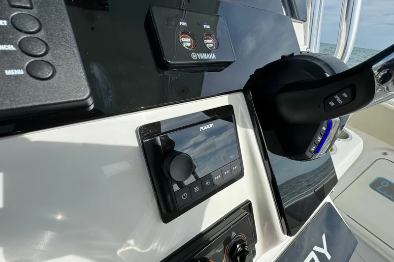 Slide: The Image of Control panel of a 2015 Century 2600 CC boat with Yamaha and Fusion systems. - 36