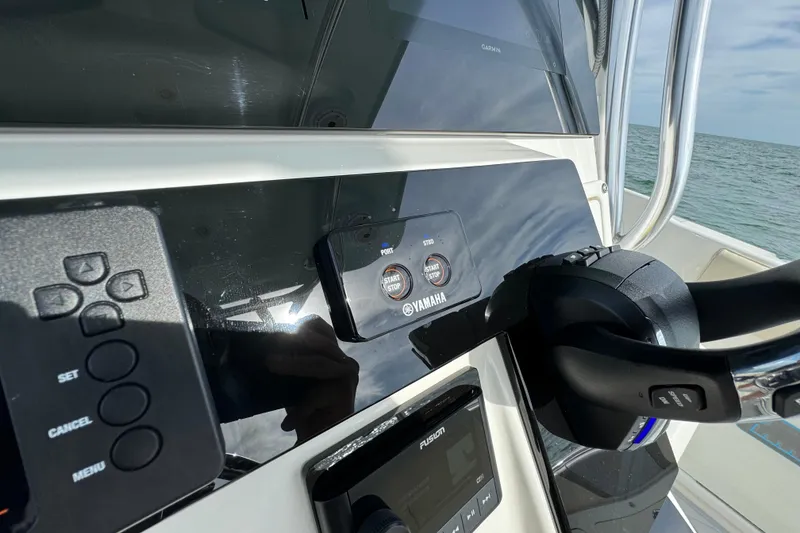 Slide: The Image of Century 2600 CC 2015 boat dashboard with Yamaha controls and ocean view. - 37