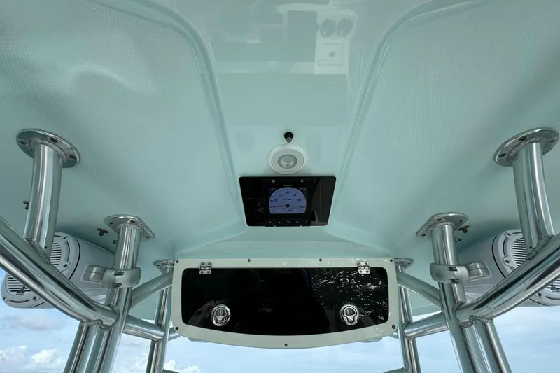 Slide: The Image of Interior view of a 2015 Century 2600 CC boat's helm with speakers and gauges. - 40