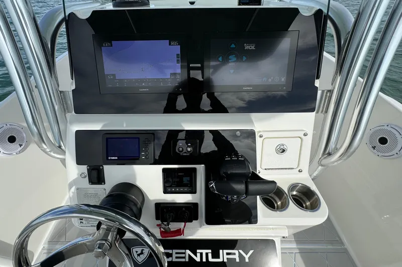 Slide: The Image of 2015 Century 2600 CC boat dashboard with navigation and control systems. - 41